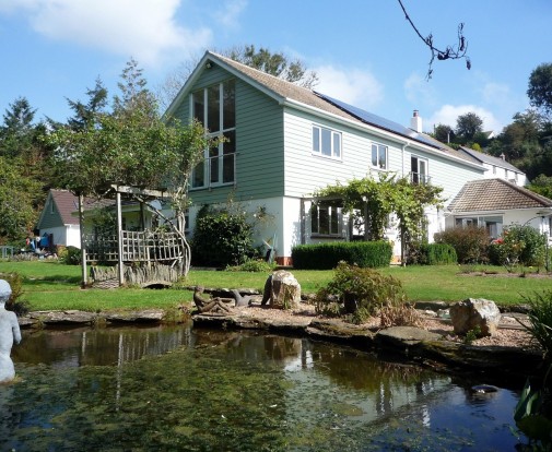 Extending Up exterior rear with pond